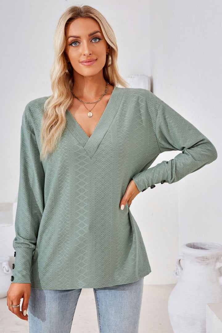 Textured knit V-neck long sleeve top with button cuffs