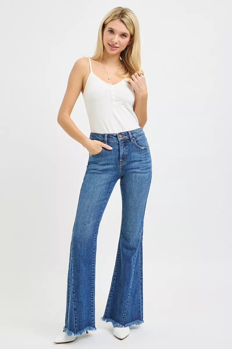 Mid-rise flare jeans with paneled side seams and raw hem