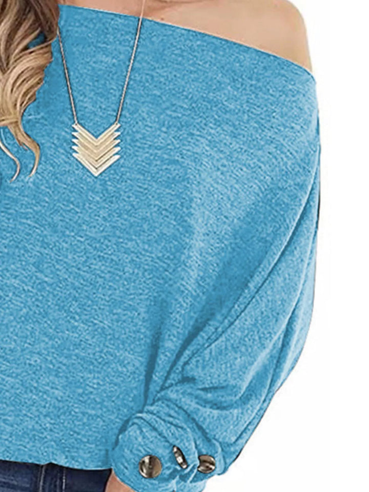 One-shoulder long sleeve top with button-cuff detail