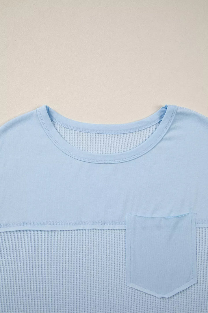 Waffle knit pocket tee with cuffed short sleeves