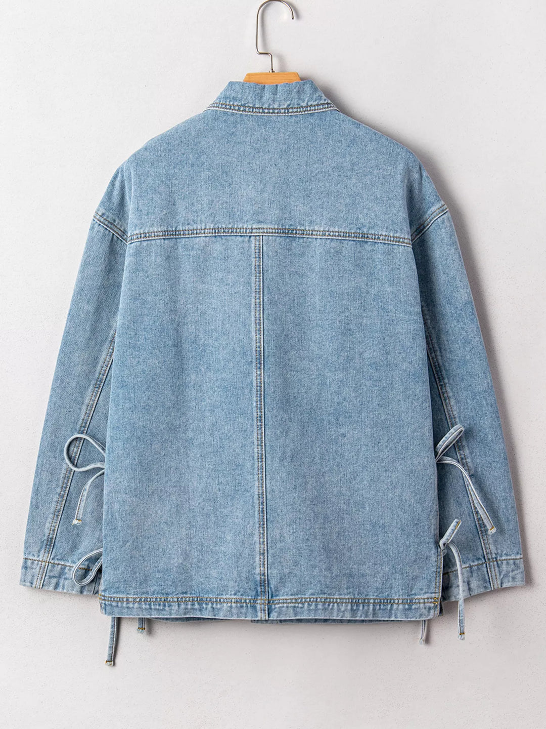 Oversized denim jacket with patch pockets and side ties