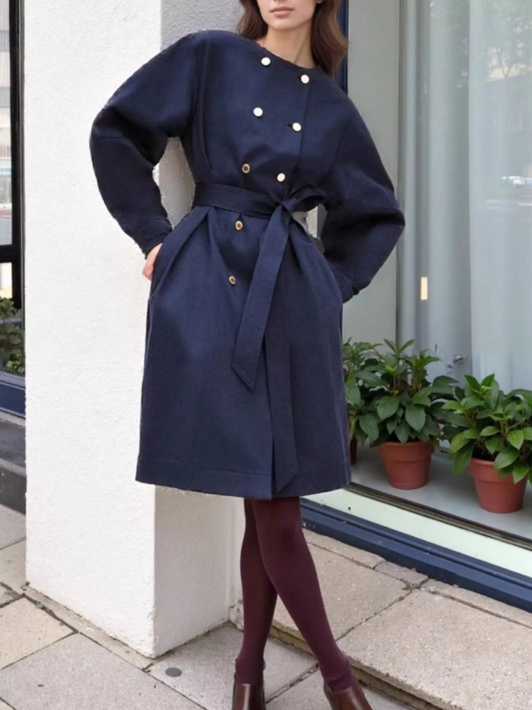 Collarless double-breasted belted trench coat with gold buttons