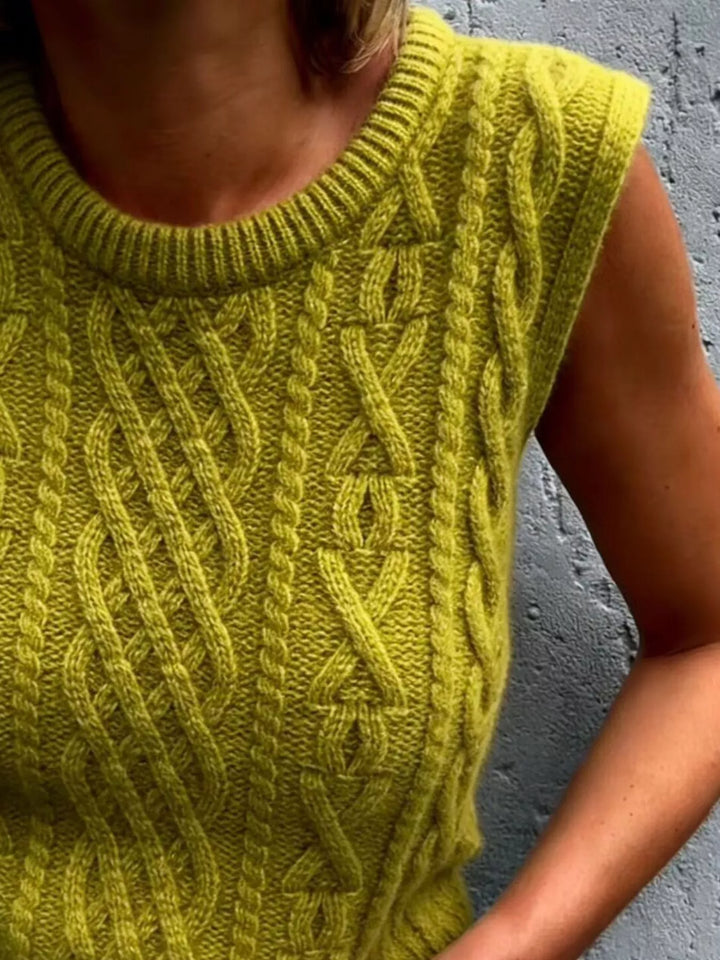 Cable knit sweater vest with ribbed crew neck