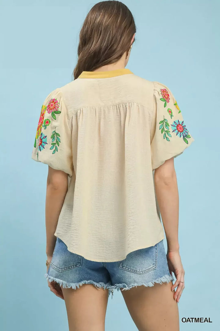 Floral embroidered puff sleeve top with split V-neck