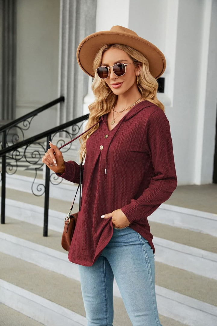 Cable knit hooded top with tie neck and button placket
