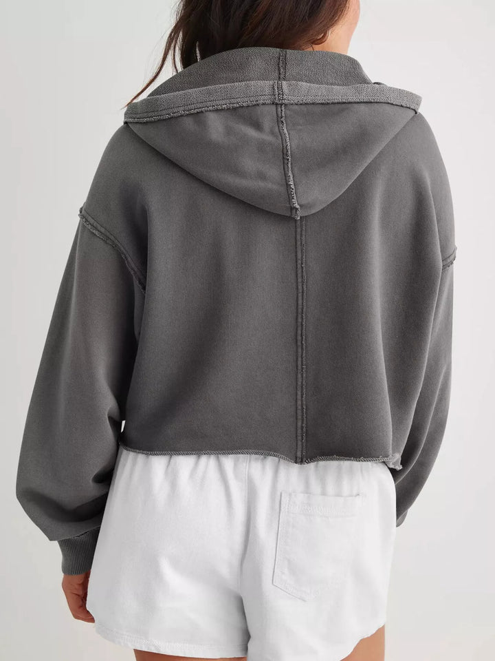 Cropped exposed-seam pullover hoodie with split neck