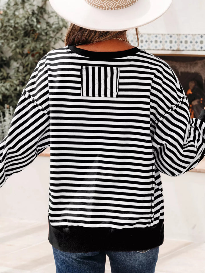 Exposed seam striped drop-shoulder pullover top