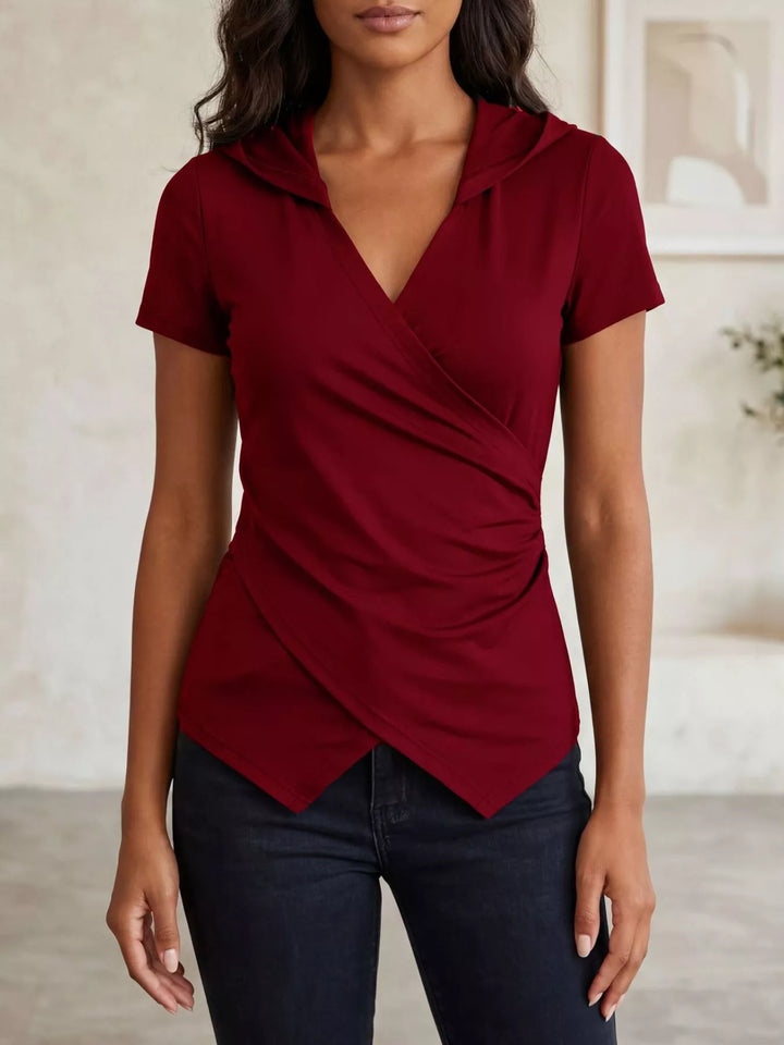Ruched wrap-front hooded top with asymmetric hem