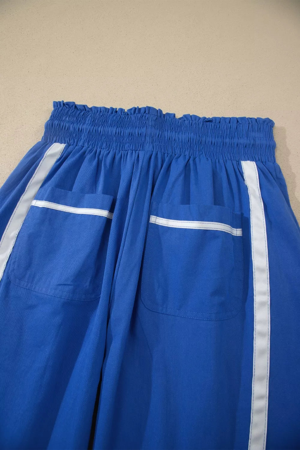 Contrast stripe smocked waist cropped track pants