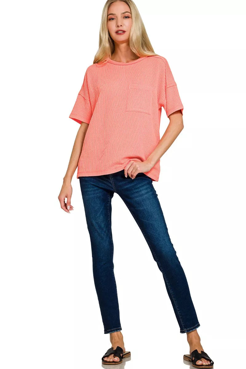 Raised rib short sleeve top with exposed seams and chest pocket
