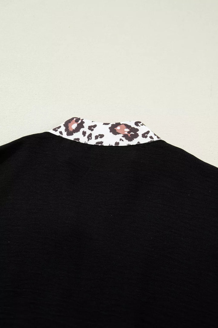 Plus size notched V-neck top with leopard collar trim