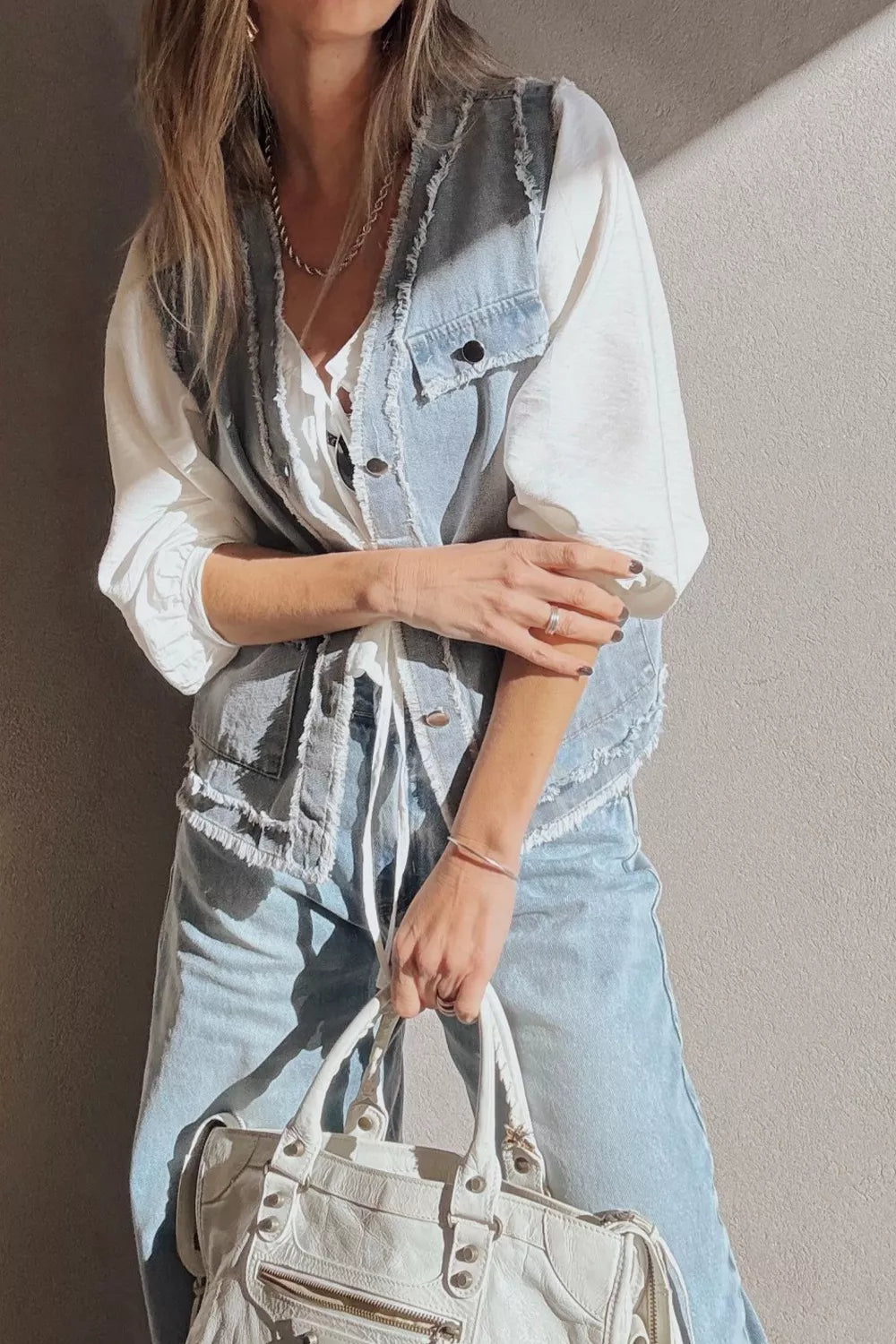Frayed edge denim vest with snap flap pockets