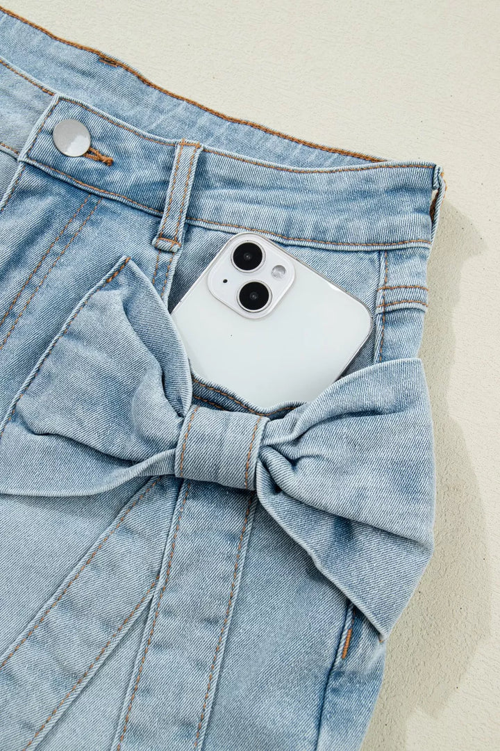 Mid-rise denim shorts with bow-tied front patch pockets