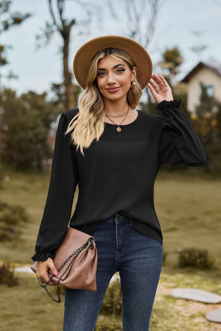 Black Eyelet knit puff sleeve blouse with round neckline
