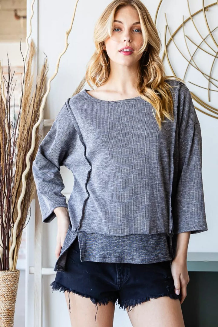 VINTAGE BLACK Exposed seam boat neck ribbed knit top with side slits