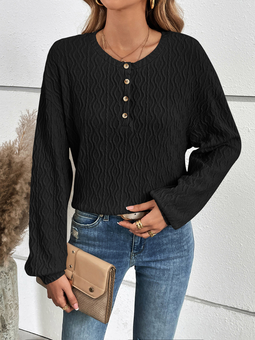 Textured half-button henley top with long sleeves