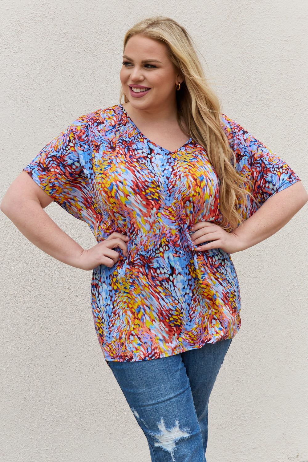 Abstract print dolman sleeve flowy V-neck top