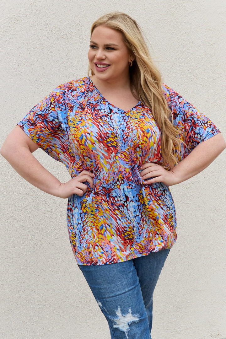 Abstract print dolman sleeve flowy V-neck top