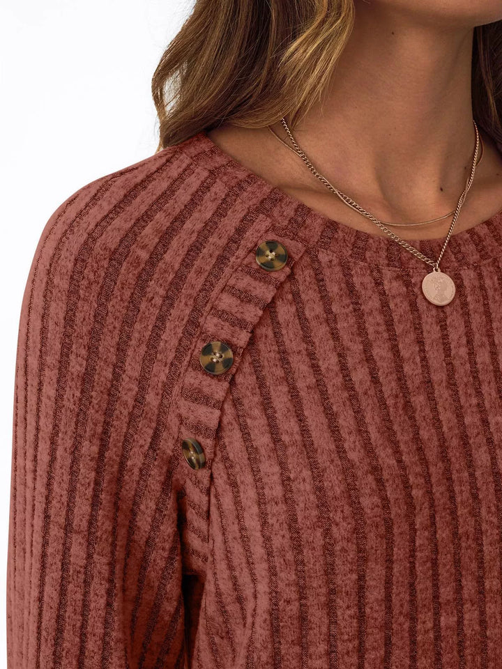 Ribbed knit long sleeve top with decorative shoulder buttons