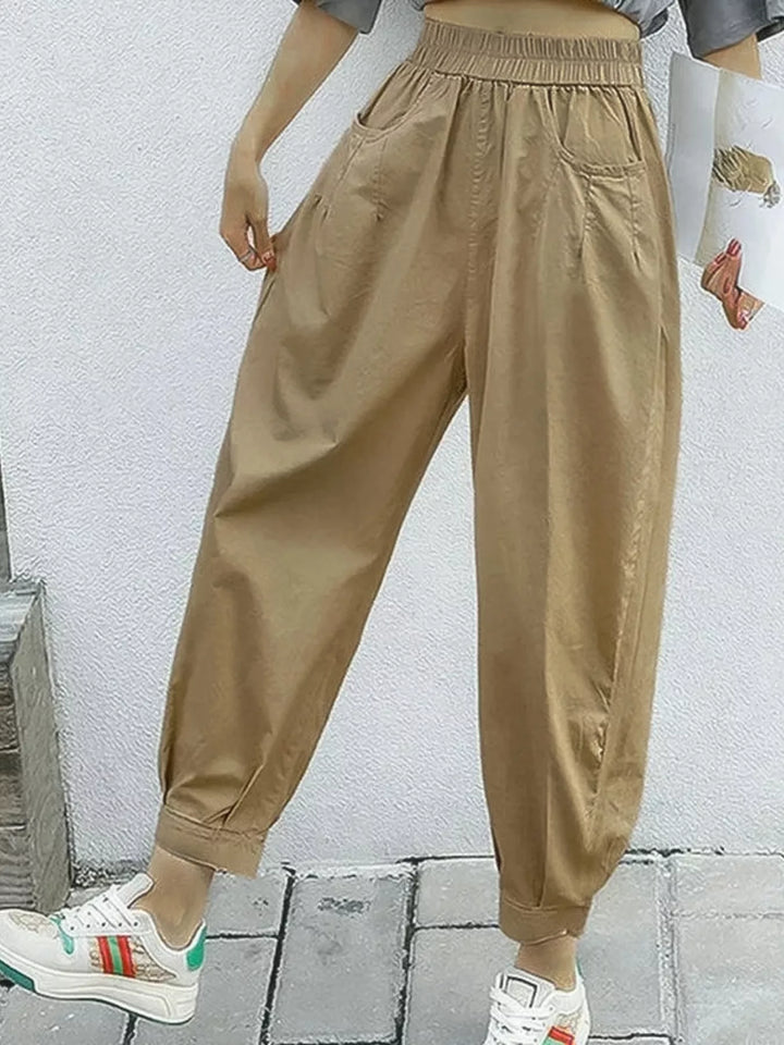 Khaki Pleated harem pants with elastic waist and tapered cuffs