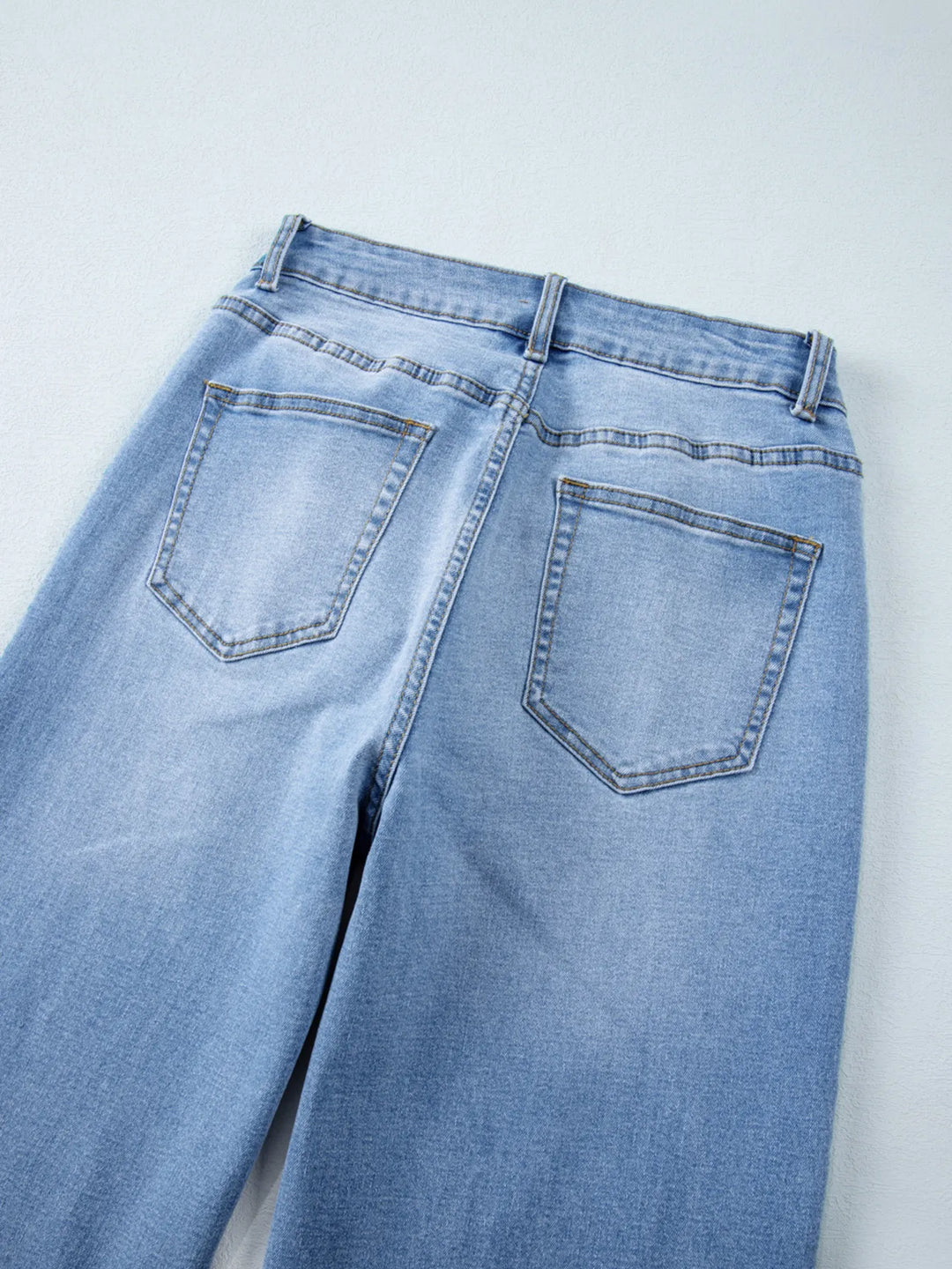 High-rise wide-leg jeans with released hem