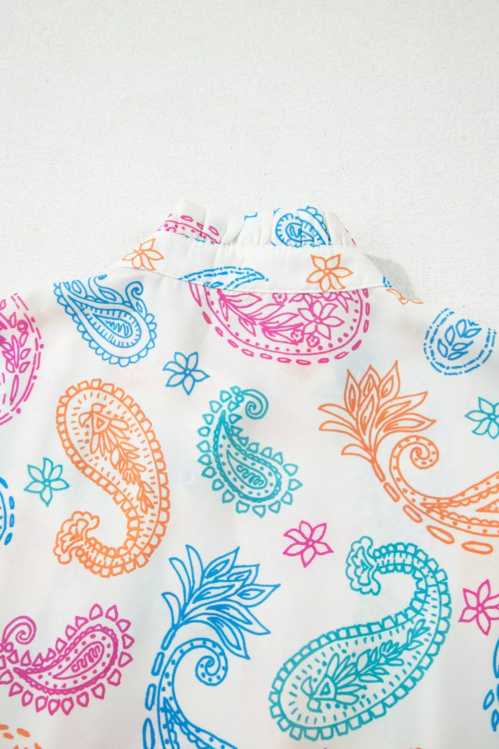 Paisley print keyhole blouse with ruffle neck and puff sleeves