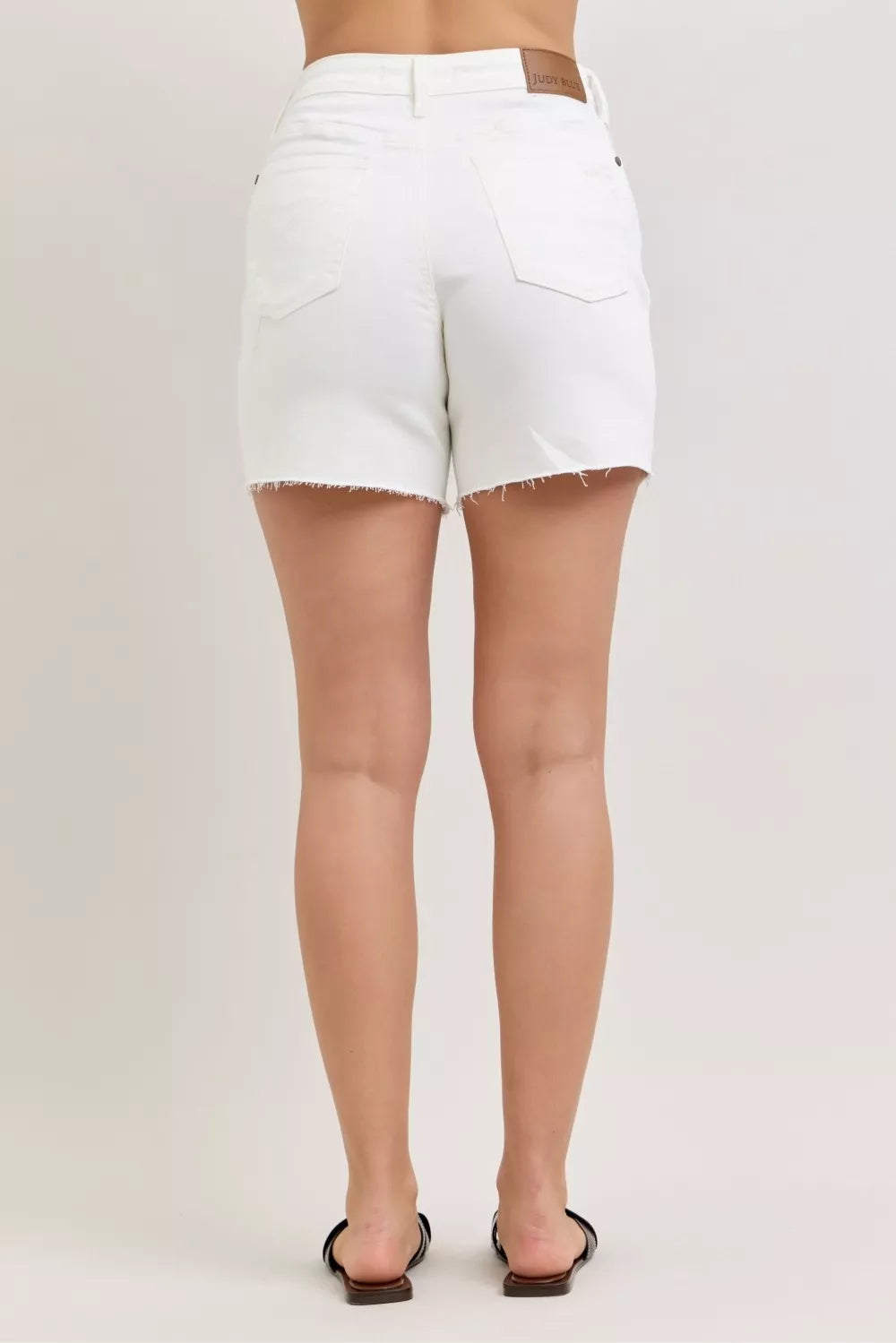 High-rise distressed denim dad shorts with raw hem