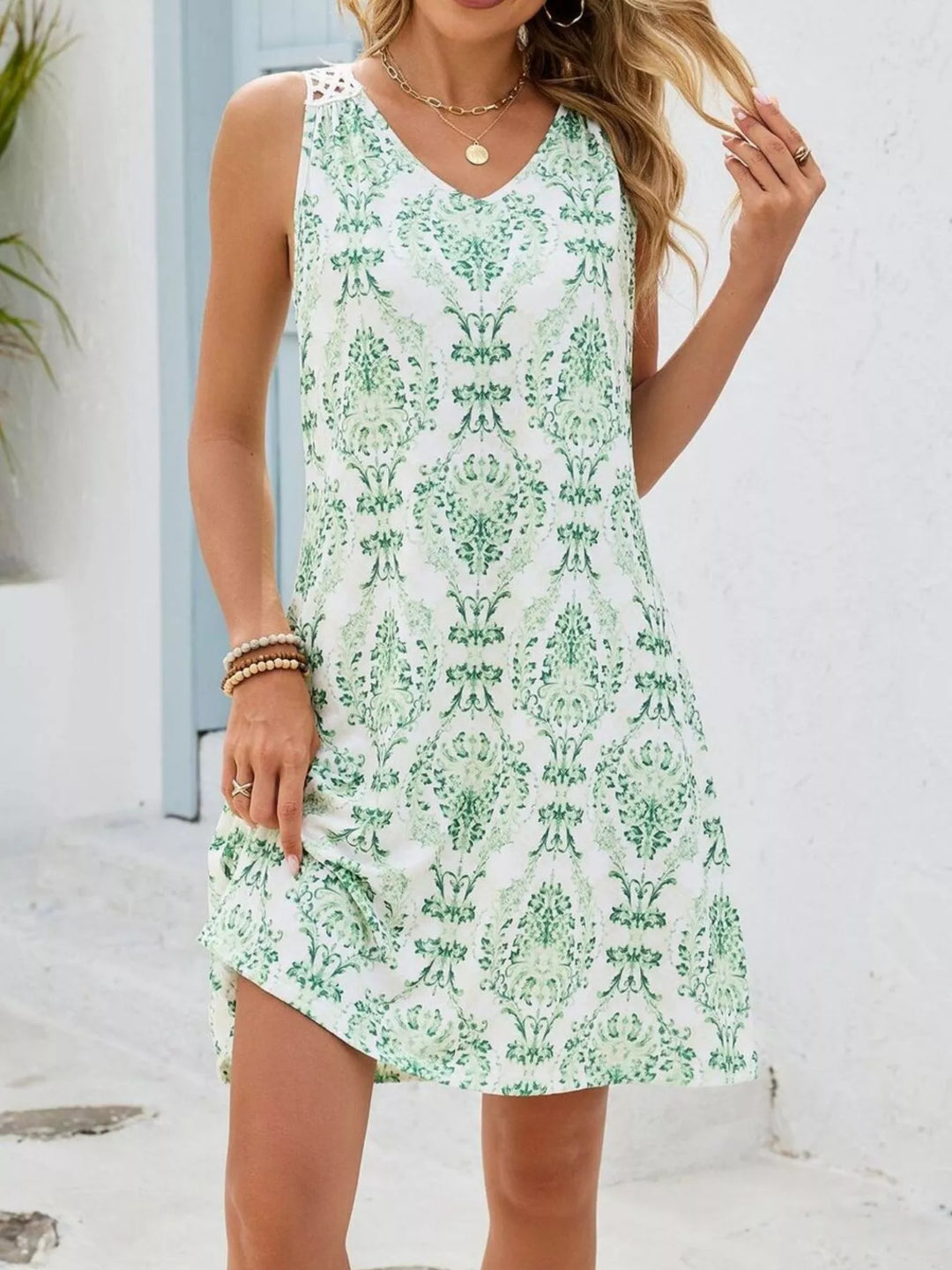 Watercolor floral mini dress with crochet cutout back