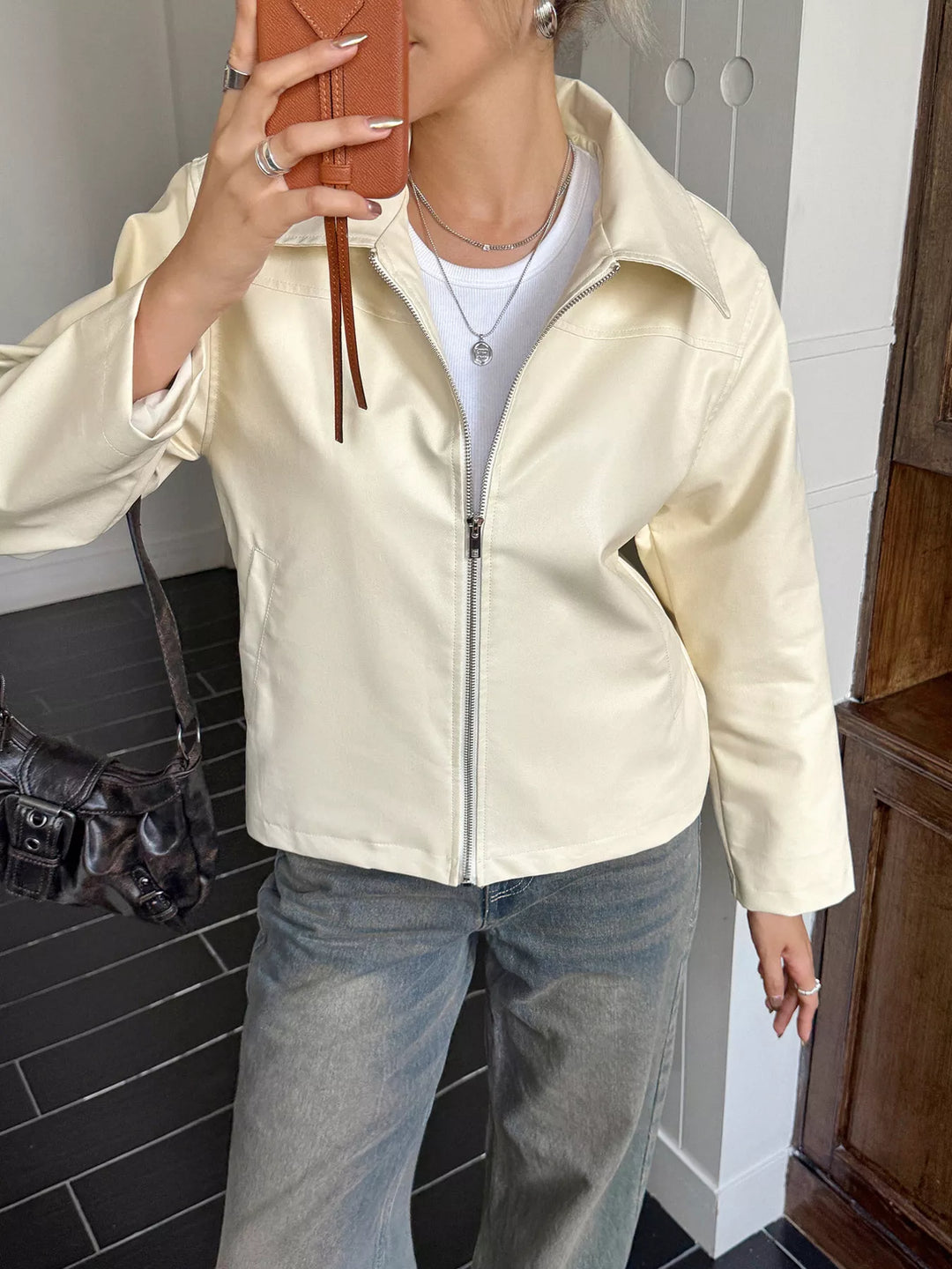 Collared faux leather zip-up jacket with patch pockets