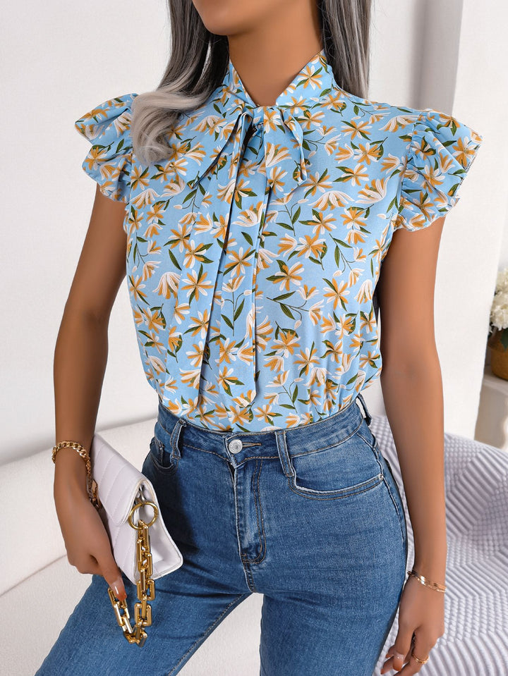 Light Blue Floral tie-neck blouse with ruffled flutter sleeves