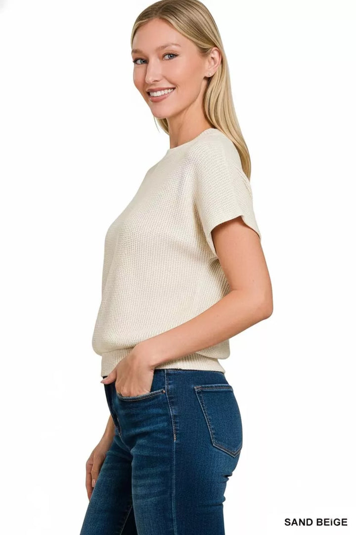 Waffle knit short sleeve sweater with banded hem