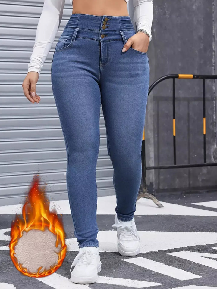 High-rise fleece-lined skinny jeans with stacked button waist