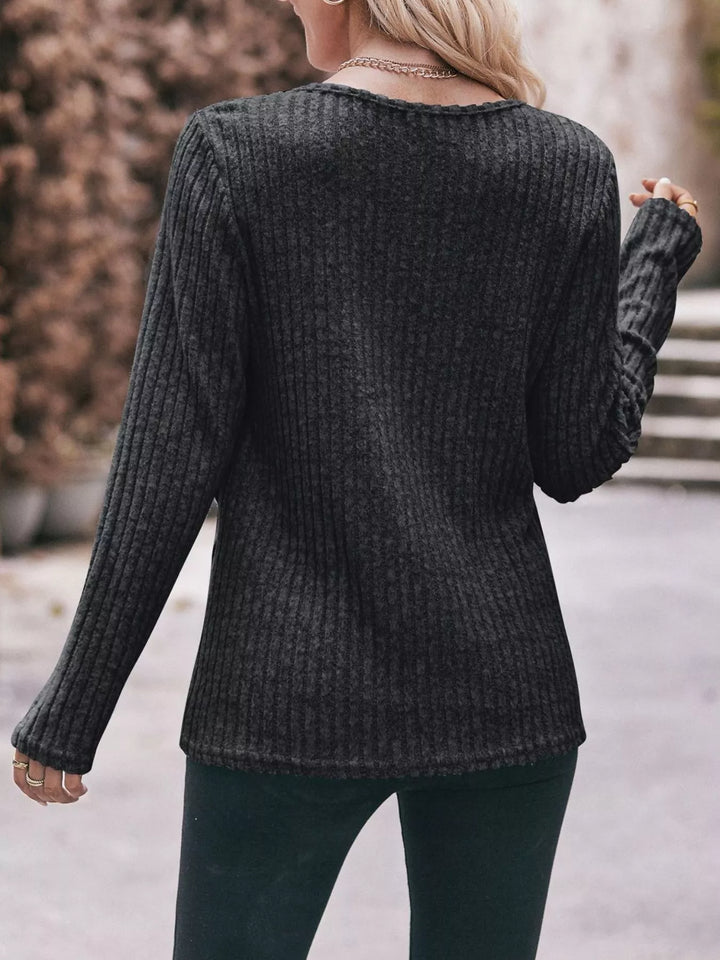 Ribbed knit long sleeve top with side button hem