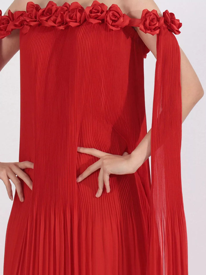 Off-shoulder pleated maxi dress with rosette neckline