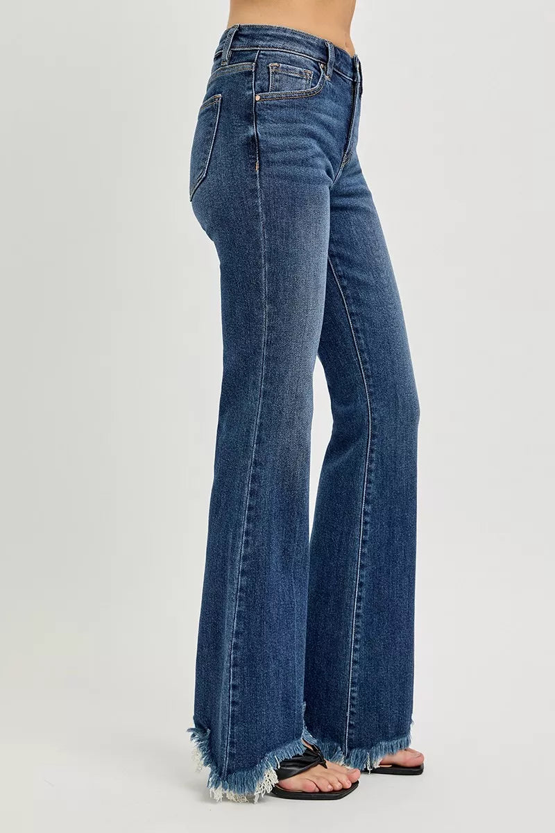 Mid-rise flare jeans with raw frayed hem in stretch denim