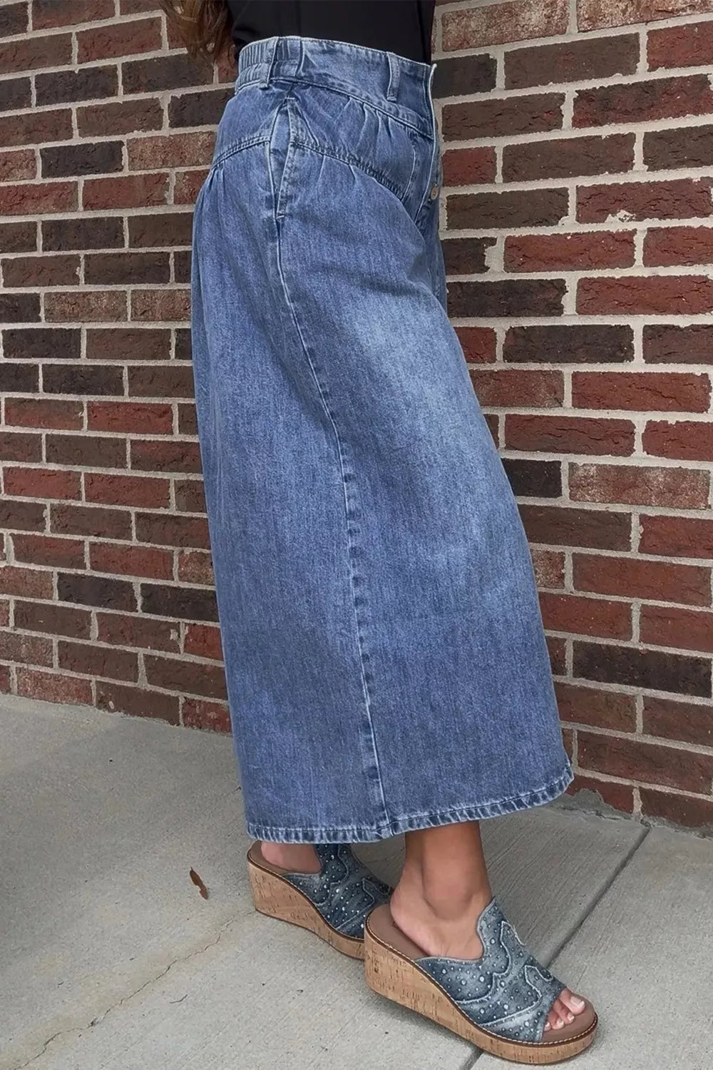 High-rise wide-leg button-fly jeans with pleated waist