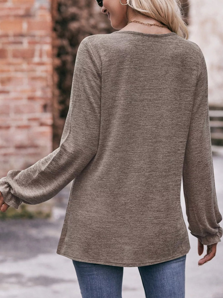 Ruffle cuff long sleeve top with pleated neckline