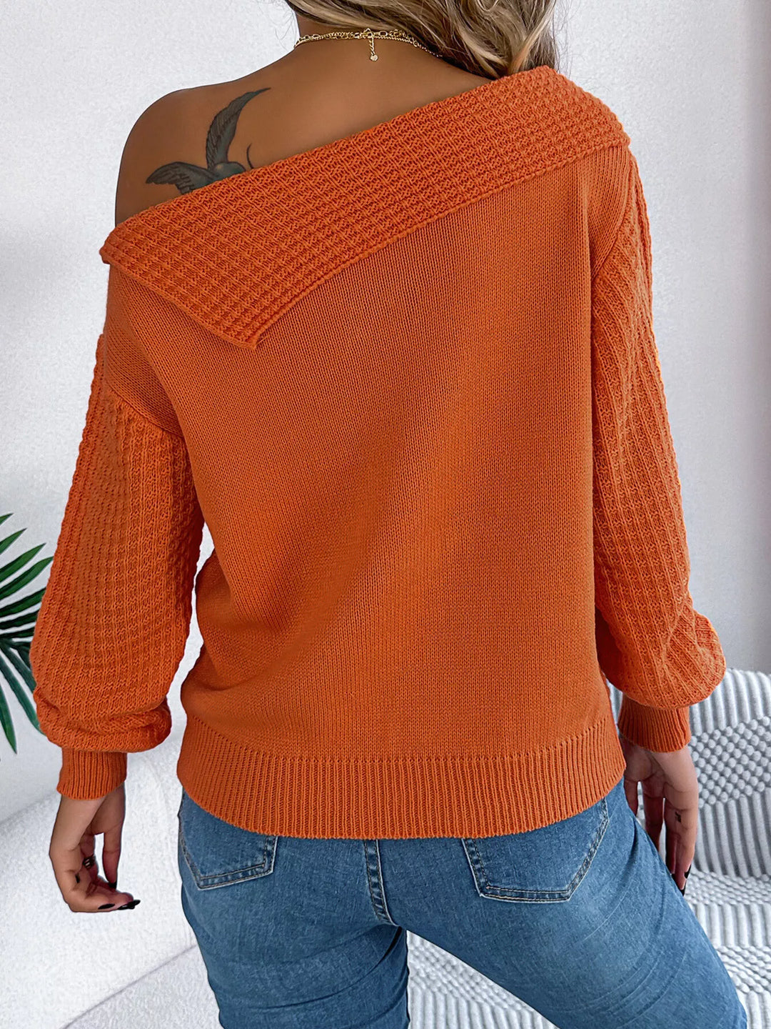 Cable knit one-shoulder sweater with fold-over ribbed collar
