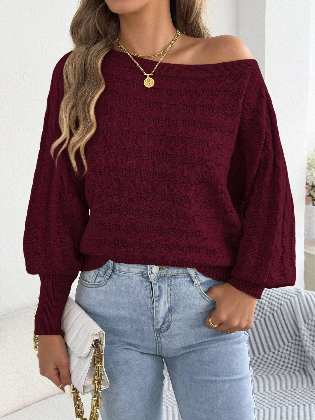 Cable knit boat neck sweater with dolman sleeves