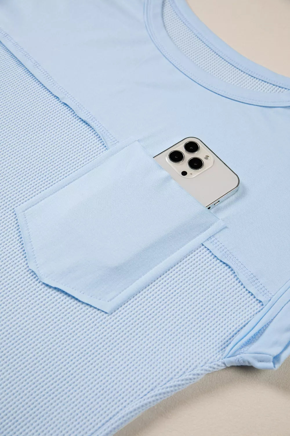 Waffle knit pocket tee with cuffed short sleeves