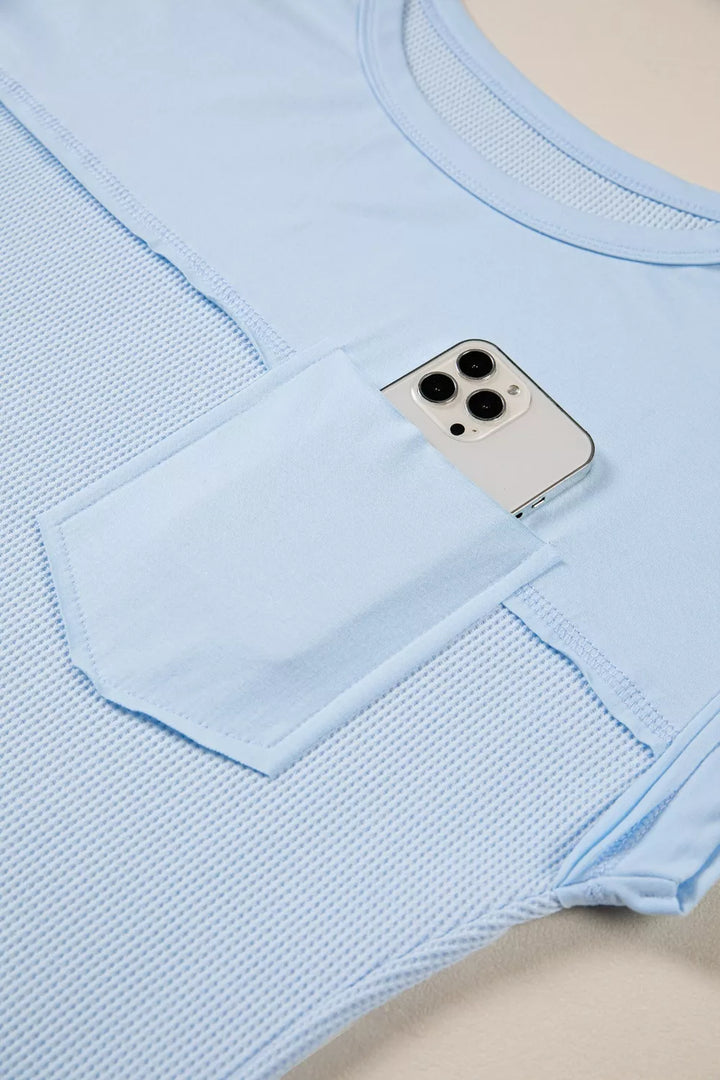 Waffle knit pocket tee with cuffed short sleeves