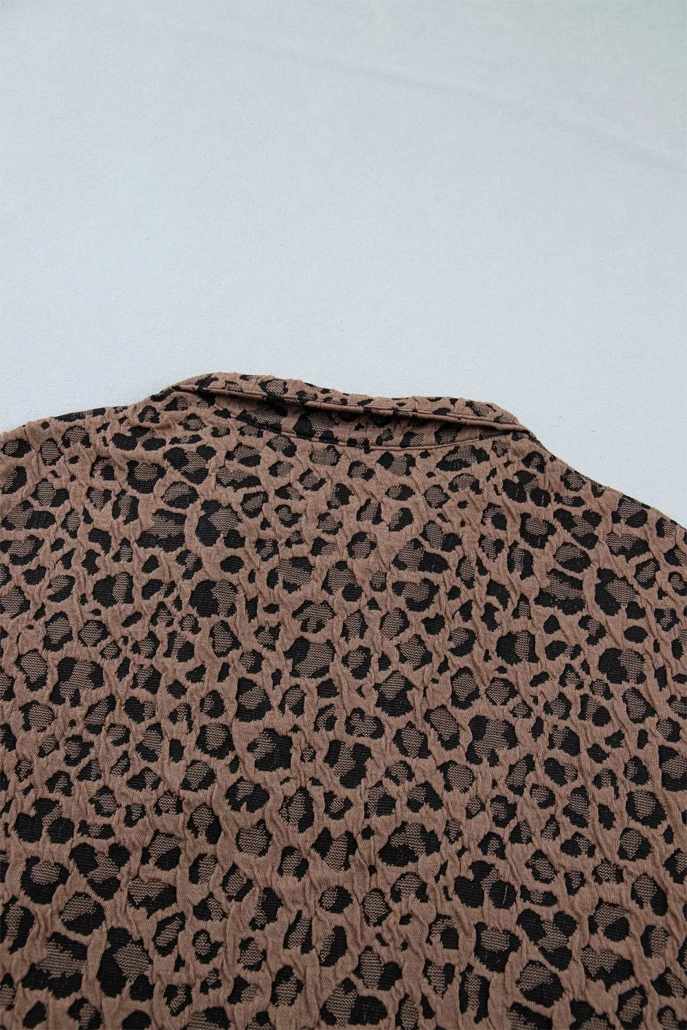 Leopard half-zip short sleeve top with striped collar and cuffs