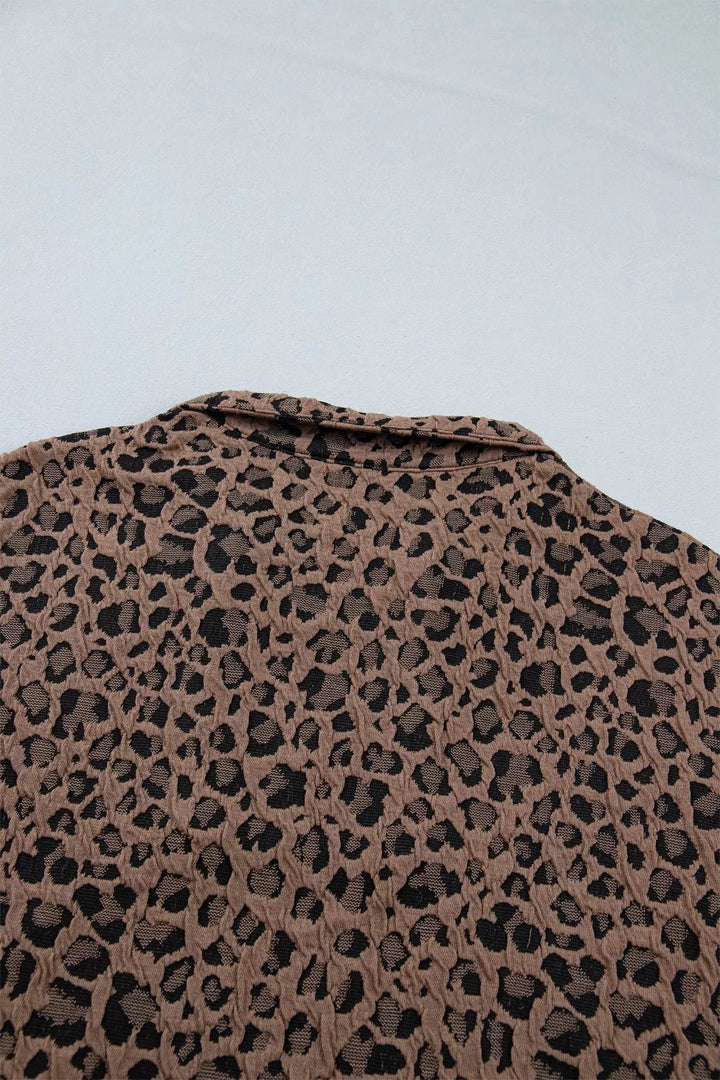Leopard half-zip short sleeve top with striped collar and cuffs