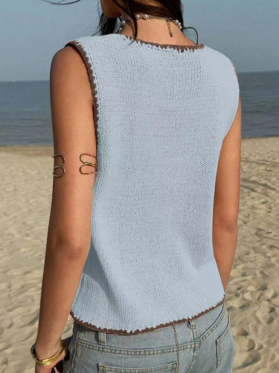 Button-front knit sweater vest with contrast whipstitch trim