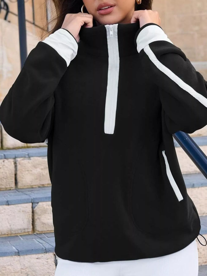 Half-zip fleece pullover with contrast trim and zip pockets