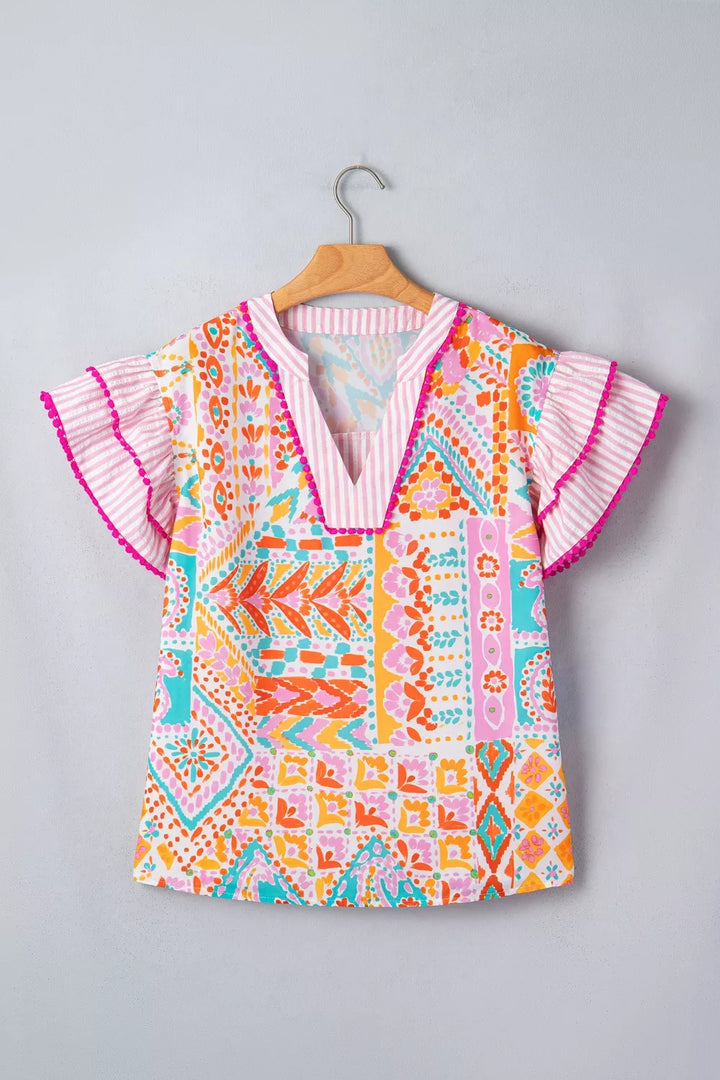 Patchwork mixed print blouse with ruffle sleeves and pom-pom trim