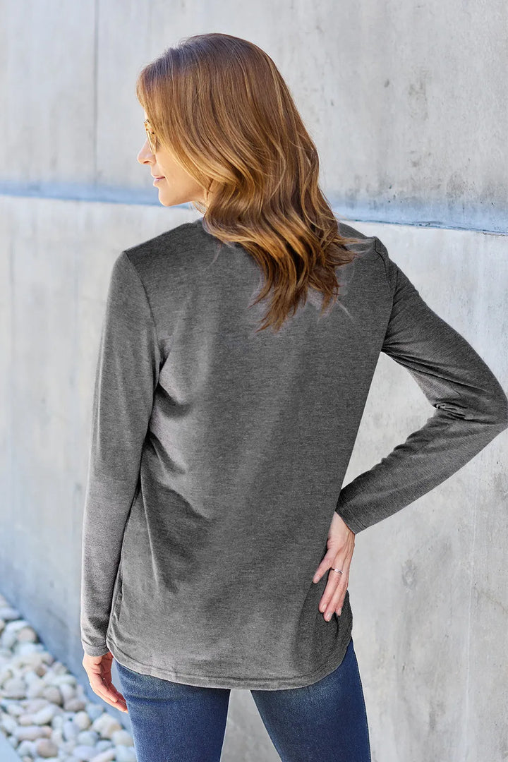 Crew neck long sleeve top with curved hem