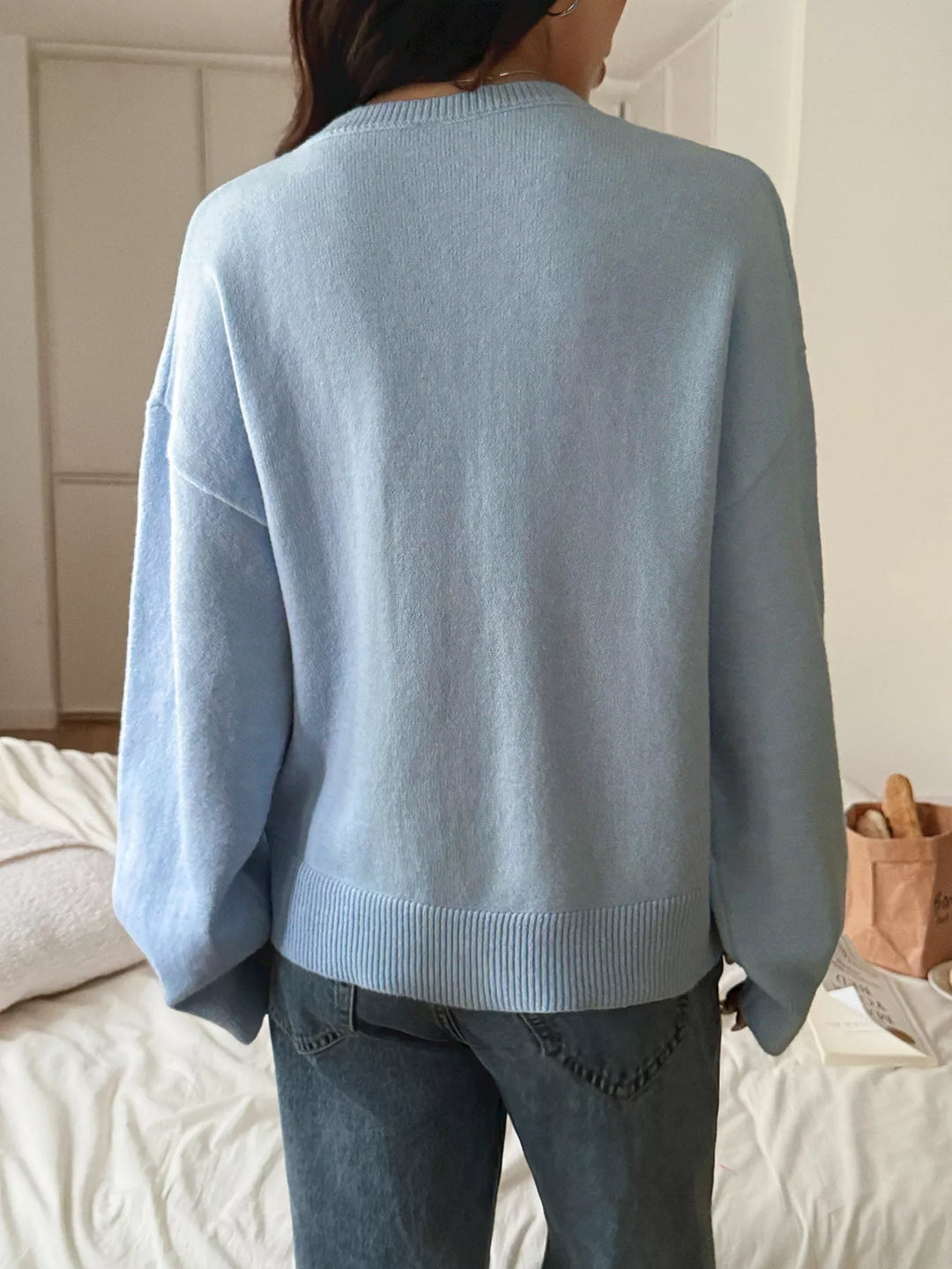V-neck loose knit sweater with ribbed trim