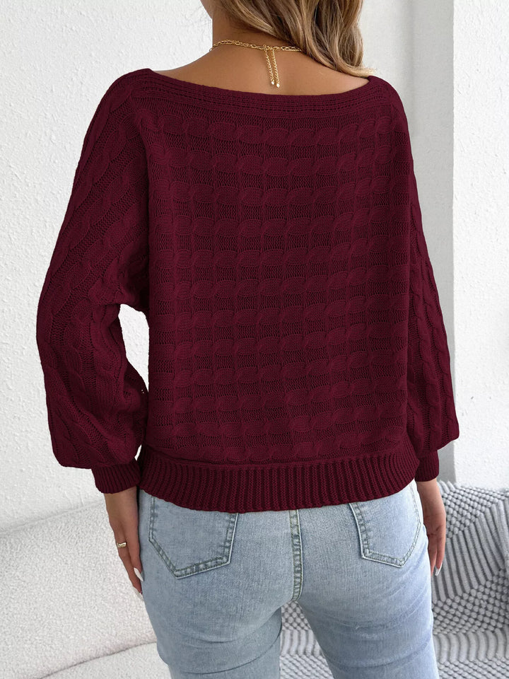 Cable knit boat neck sweater with dolman sleeves