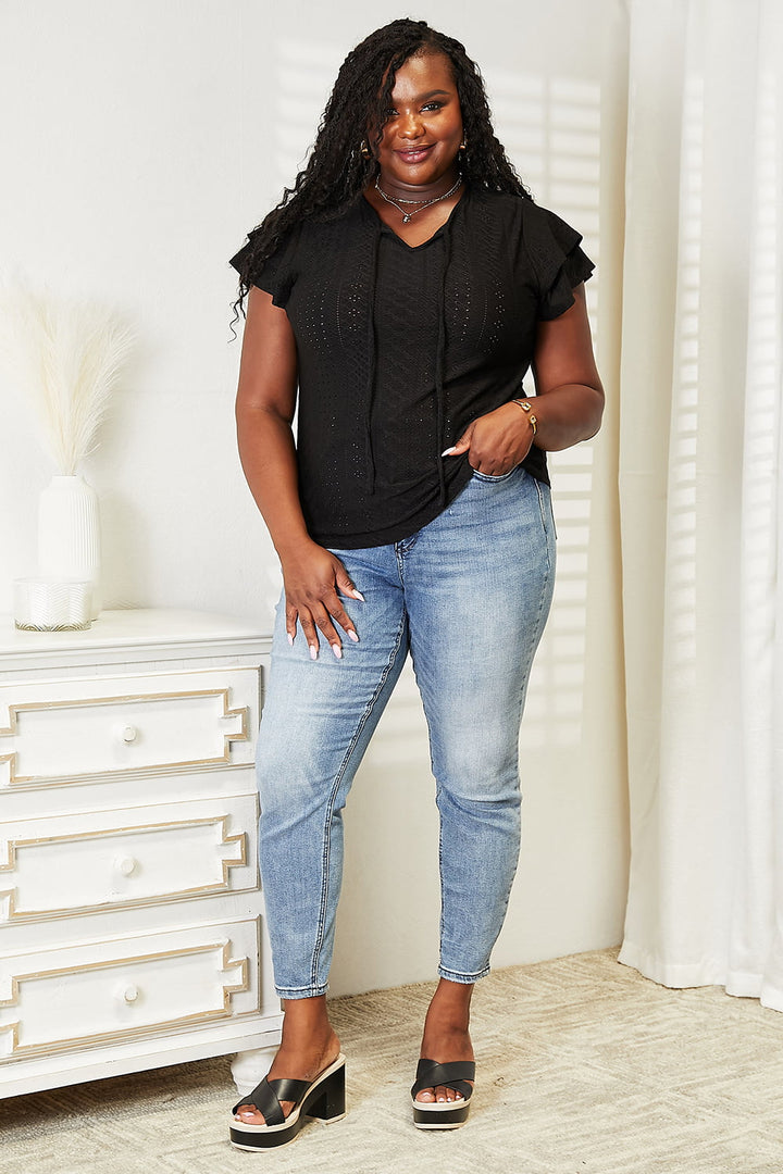 Eyelet tie-neck blouse with tiered flutter sleeves